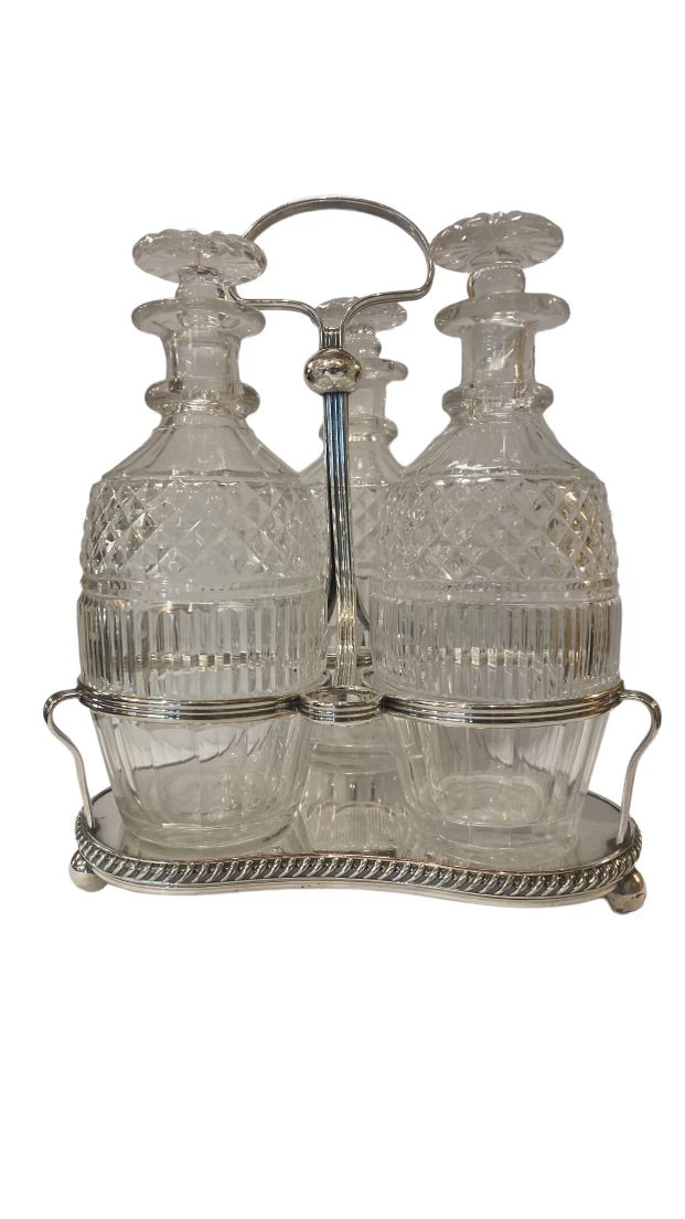 Set of Three Crystal Decanters in Silver Stand